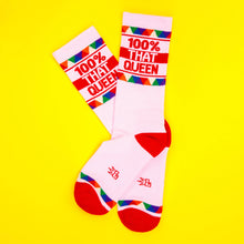 Load image into Gallery viewer, Pink crew socks with red heel and toe featuring “100% That Queen” text and colorful geometric pattern.