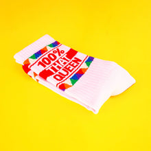 Load image into Gallery viewer, Pink crew socks with red heel and toe featuring “100% That Queen” text and colorful geometric pattern.