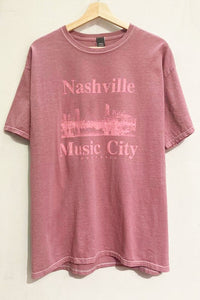 Our oversized, soft, Nashville Music City Graphic Tee has short sleeves, a crew neckline and vintage style fabric. Wear this soft tee on lounge days or dress it up with leather pants and boots. 