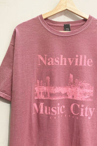 Our oversized, soft, Nashville Music City Graphic Tee has short sleeves, a crew neckline and vintage style fabric. Wear this soft tee on lounge days or dress it up with leather pants and boots. 