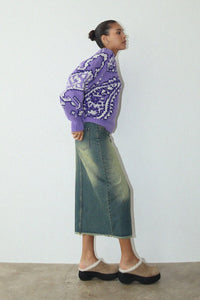 Stay cozy and comfortable in this colorful bandana-inspired sweater. Featuring a relaxed fit, this piece can be dressed up or down as desired. Show off your vibrant, trendy style in this cozy, soft purple paisley printed sweater. It’s the perfect piece to wear around town on a cold day, whether you're out with friends or relaxing at home.