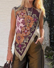Load image into Gallery viewer, Model wearing a boho floral fringe scarf top with an asymmetrical handkerchief hem, vintage-inspired print in burgundy and olive tones, and decorative fringe trim.