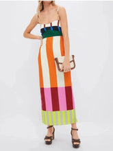 Load image into Gallery viewer, Woman wearing a colorful striped dress on a white background