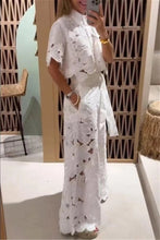 Load image into Gallery viewer, Person wearing a white floral outfit taking a mirror selfie.