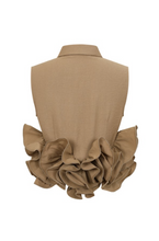 Load image into Gallery viewer, Beige sleeveless button-up blouse with dramatic oversized side ruffles, structured collar, and tailored silhouette displayed on a white background.