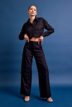 Load image into Gallery viewer, Structured black cropped cargo jacket with stretch and utility pockets. A polished, fashion-forward layer. Matching cargo pants sold separately.