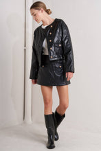 Load image into Gallery viewer, Woman wearing a black leather jacket, skirt, and boots from Glam Expressway
