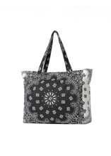 Load image into Gallery viewer, Black and white bandana print oversized tote bag featuring a bold paisley pattern, spacious interior, and double shoulder straps for everyday use.