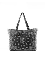 Load image into Gallery viewer, Black and white bandana print oversized tote bag featuring a bold paisley pattern, spacious interior, and double shoulder straps for everyday use.