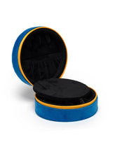 Load image into Gallery viewer, Blue velvet caviar tin jewelry case with embroidered caviar fish graphic and zipper closure, designed to store rings, earrings, necklaces, and other small accessories while traveling.