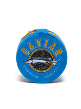 Load image into Gallery viewer, Blue velvet caviar tin jewelry case with embroidered caviar fish graphic and zipper closure, designed to store rings, earrings, necklaces, and other small accessories while traveling.