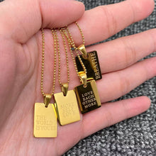Load image into Gallery viewer, 18K gold-plated rectangular pendant necklace engraved with the word “BREATHE” on a delicate gold chain.
