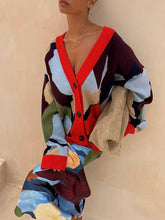 Load image into Gallery viewer, Person wearing a colorful cardigan with a neutral background