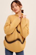 Load image into Gallery viewer, Woman wearing a mustard yellow sweater with black abstract design on a beige background