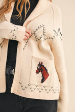 Load image into Gallery viewer, Beige cardigan with embroidered design on a neutral background