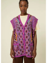 Load image into Gallery viewer, Add a pop of color and texture to your outfit with our Magenta Multicolored Cardigan. This beautiful magenta cardigan vest is soft and chic with a 90's vibe. It can be worn layered or on its own, making it the perfect accessory for any outfit. Perfect for layering in the cooler months or on its own. Made from soft, high quality wool, this oversized sweater is as cozy as it is cute!