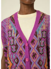 Load image into Gallery viewer, Add a pop of color and texture to your outfit with our Magenta Multicolored Cardigan. This beautiful magenta cardigan vest is soft and chic with a 90's vibe. It can be worn layered or on its own, making it the perfect accessory for any outfit. Perfect for layering in the cooler months or on its own. Made from soft, high quality wool, this oversized sweater is as cozy as it is cute!