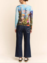 Load image into Gallery viewer, Sheer long sleeve mesh top with vibrant floral field print in soft focus colors, worn by a model.
