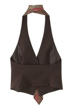 Load image into Gallery viewer, Chocolate brown tailored vest top with halter neckline and geometric print tie detail on white background.