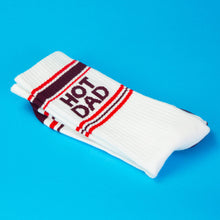 Load image into Gallery viewer, White Hot Dad gym crew socks featuring burgundy HOT DAD lettering, retro red and burgundy athletic stripes, and contrasting burgundy heels and toes.
