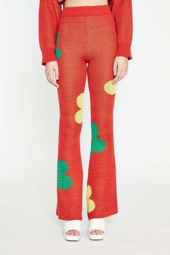 Like its matching sweater, the Red Glitter Floral Knit Pants are attention-grabbing with their metallic sheen and fun print. These cherry red knit pants have a yellow and green floral print, a subtle shimmer and lots of stretch.