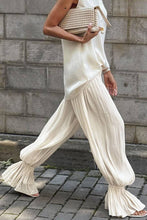 Load image into Gallery viewer, Ivory lightweight harem pants featuring a flowy crinkle texture and gathered cuffs, styled for vacation, resort, and coastal-inspired outfits.