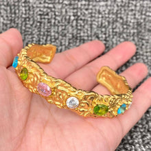 Load image into Gallery viewer, Hammered 18K gold-plated stainless steel cuff bracelet featuring multicolor pink, green, blue and clear zircon stones.