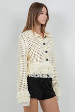 Load image into Gallery viewer, Lemon yellow fringe knit cotton cardigan sweater with button front, open knit texture, and fringe trim at hem and cuffs worn with black shorts.