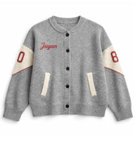 Load image into Gallery viewer, Gray varsity jacket with red and white accents on a white background