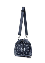 Load image into Gallery viewer, Navy blue bandana print convertible bucket bag with drawstring closure and adjustable straps that can be worn as a backpack, shoulder bag, or crossbody bag.