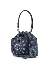 Load image into Gallery viewer, Navy blue bandana print convertible bucket bag with drawstring closure and adjustable straps that can be worn as a backpack, shoulder bag, or crossbody bag.