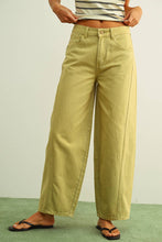 Load image into Gallery viewer, Olive green high-rise wide-leg jeans with relaxed barrel silhouette styled with sandals for an effortless everyday look.