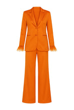 Load image into Gallery viewer, Orange suit with feather wrist cuffs on a white background