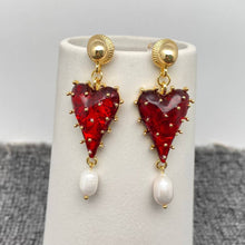 Load image into Gallery viewer, Red strawberry heart statement earrings with gold-tone details and dangling white pearl accents.