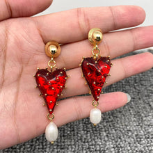 Load image into Gallery viewer, Red strawberry heart statement earrings with gold-tone details and dangling white pearl accents.