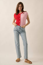 Load image into Gallery viewer, Woman wearing a red and pink button-up shirt with light blue jeans on a beige background