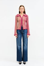 Load image into Gallery viewer, Woman wearing a Glam Expressway pink knitted cardigan and blue jeans on a white background