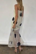 Load image into Gallery viewer, Woman wearing a long, sheer dress with black polka dots against a white background