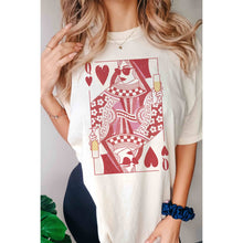 Load image into Gallery viewer, Model wearing an oversized light cream Champagne Queen of Hearts graphic t-shirt featuring a red vintage playing card design, styled casually with jewelry in a studio setting.