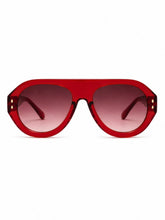 Load image into Gallery viewer, Oversized ruby red sunglasses with a translucent frame and gradient tinted lenses, shown on a model and on a white background.