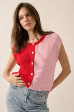 Load image into Gallery viewer, Woman wearing a red and pink sleeveless knit cardigan with a beige background