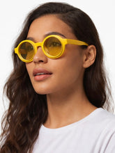 Load image into Gallery viewer, Bright yellow round sunglasses with tinted lenses and retro-inspired circular frame.