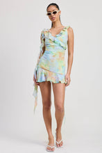 Load image into Gallery viewer, Woman wearing a colorful tie-dye dress on a white background