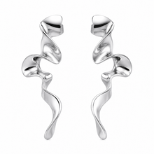 Load image into Gallery viewer, Silver Ribbon Statement Earrings featuring a sculptural abstract ribbon design with a polished silver finish displayed on a clean white background.
