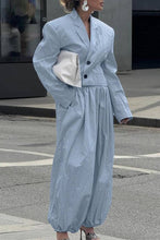 Load image into Gallery viewer, Woman wearing a sky blue cropped blazer and matching relaxed balloon pants styled with heels and a white clutch.