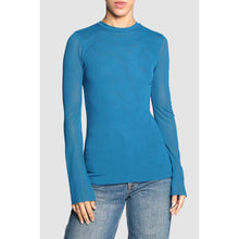 Load image into Gallery viewer, Blue long-sleeve shirt worn by a person on a light gray background