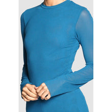 Load image into Gallery viewer, Blue long-sleeve top worn by a person on a white background