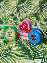 Load image into Gallery viewer, Blue velvet caviar tin jewelry case with embroidered caviar fish graphic and zipper closure, designed to store rings, earrings, necklaces, and other small accessories while traveling.