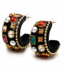 Load image into Gallery viewer, Black velvet statement hoop earrings embellished with colorful crystals, faux pearls and gold detailing on a luxury textured finish.
