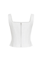 Load image into Gallery viewer, White structured bustier top featuring wide straps and multiple crystal floral embellishments across the front, photographed on a white background.